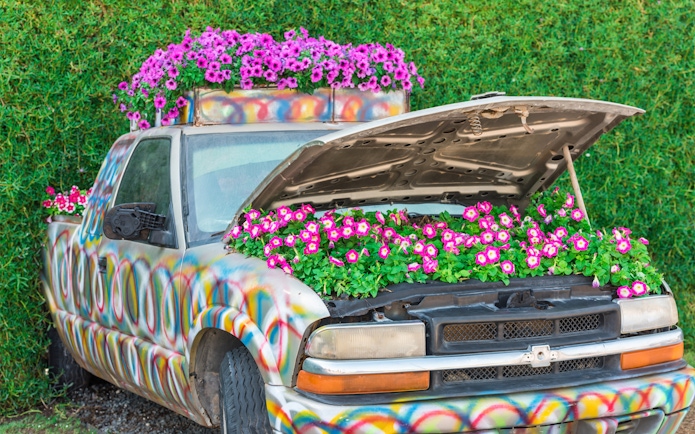 Colorful truck with flowers in the hood at Dubai Miracle Garden.
