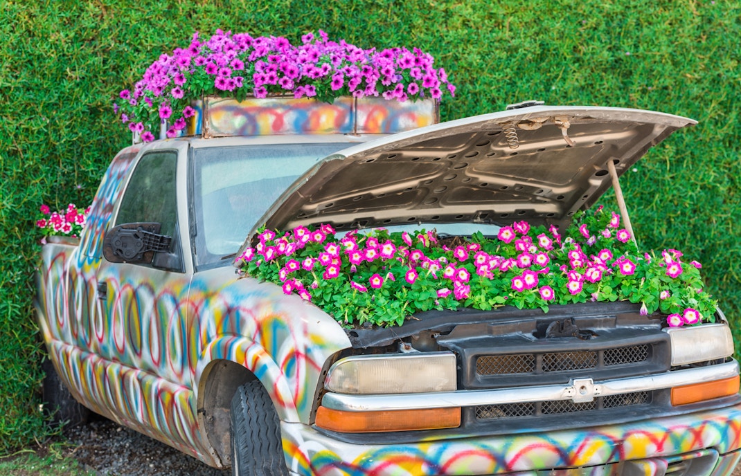 Colorful truck with flowers in the hood at Dubai Miracle Garden.