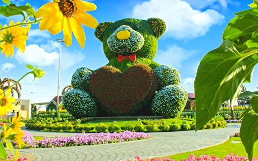 Giant floral teddy bear sculpture at Dubai Miracle Garden.