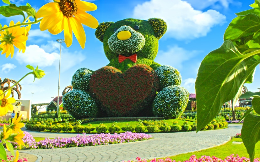 Giant floral teddy bear sculpture at Dubai Miracle Garden.