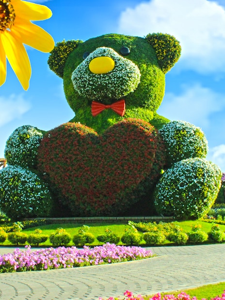 Giant floral teddy bear sculpture at Dubai Miracle Garden.