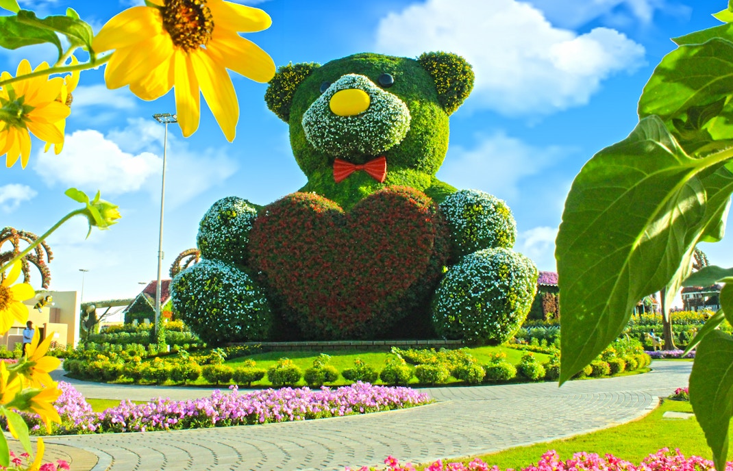 Giant floral teddy bear sculpture at Dubai Miracle Garden.
