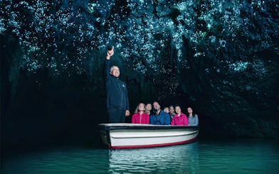 Boat tour under glowworms in Waitomo Caves, New Zealand.