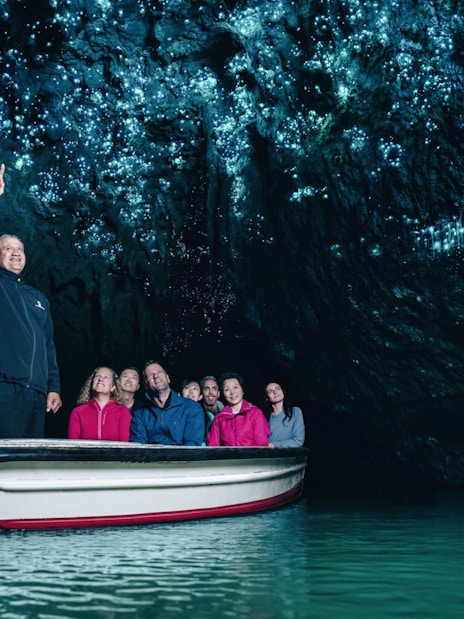 Boat tour under glowworms in Waitomo Caves, New Zealand.