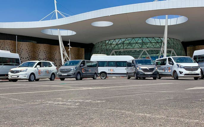 Ourika private transfer vehicles parked at Marrakesh airport.