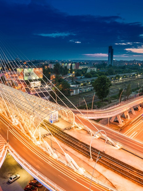Bucharest's Basarab Bridge illuminated at night during an after-dark sightseeing tour.