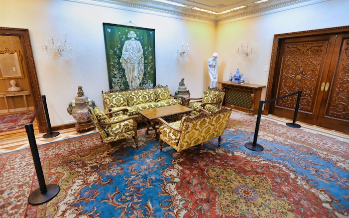 Elegant sitting room in Ceausescu Mansion with ornate furniture and artwork.