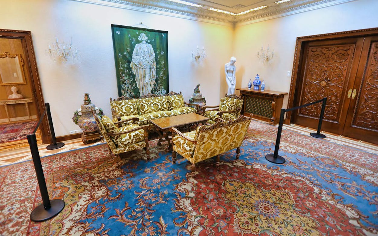 Elegant sitting room in Ceausescu Mansion with ornate furniture and artwork.