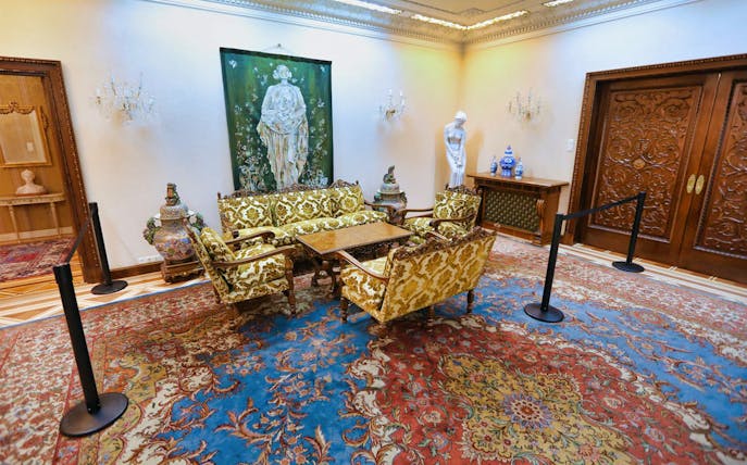 Elegant sitting room in Ceausescu Mansion with ornate furniture and artwork.