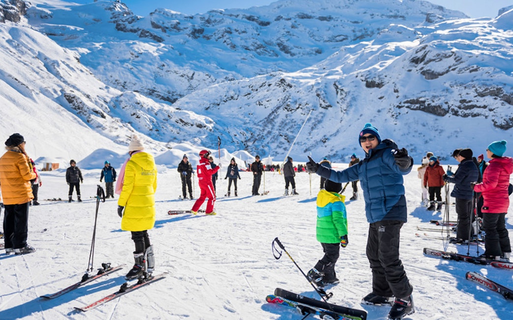 Skiers gather on snowy slopes during Lucerne and Titlis Snow Experience.