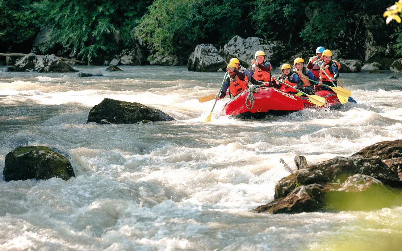 River rafting group navigating rapids at Brienz, Switzerland.