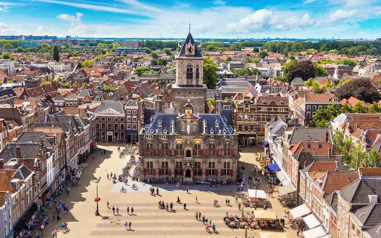 Aerial view of Brussels cityscape with historic buildings and bustling square.