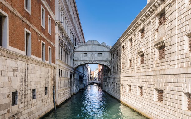 Bridge of Sighs over canal in Venice, Italy, part of self-guided tour.