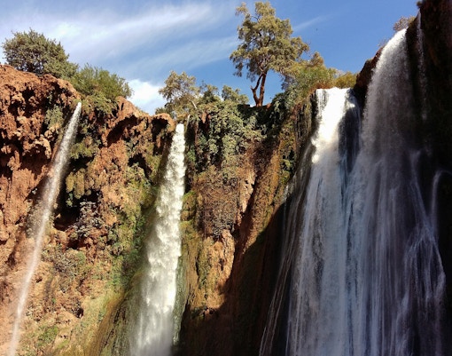 Ouzoud Waterfalls cascading over rocky cliffs on a day tour from Marrakesh.