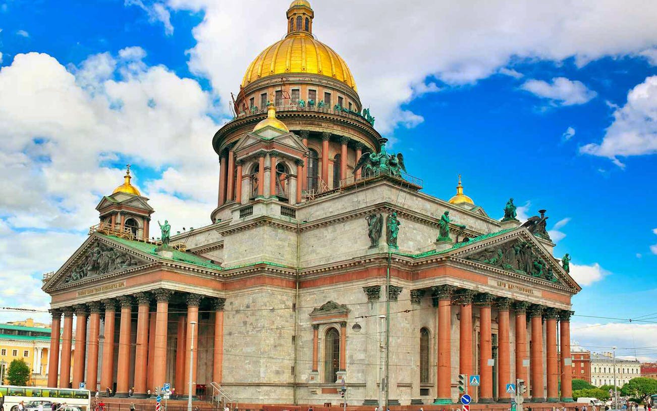 St. Isaac's Cathedral in St. Petersburg with golden dome and ornate columns.