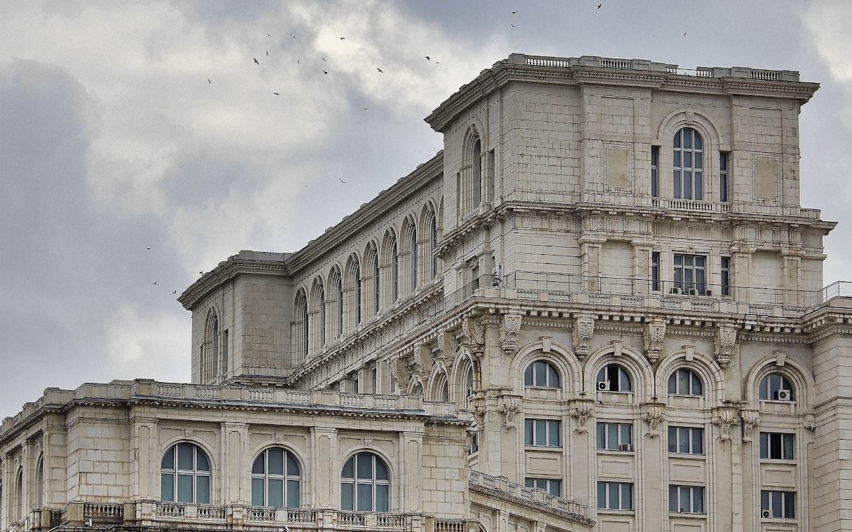 Palace of Parliament facade with arched windows in Bucharest, Romania.