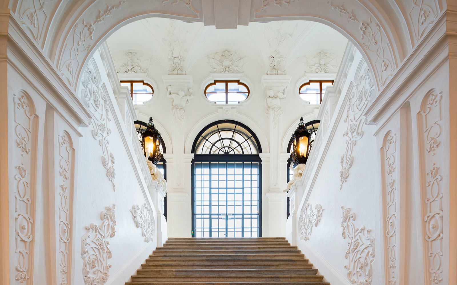 Staircase with ornate carvings at Belvedere Palace, Vienna.