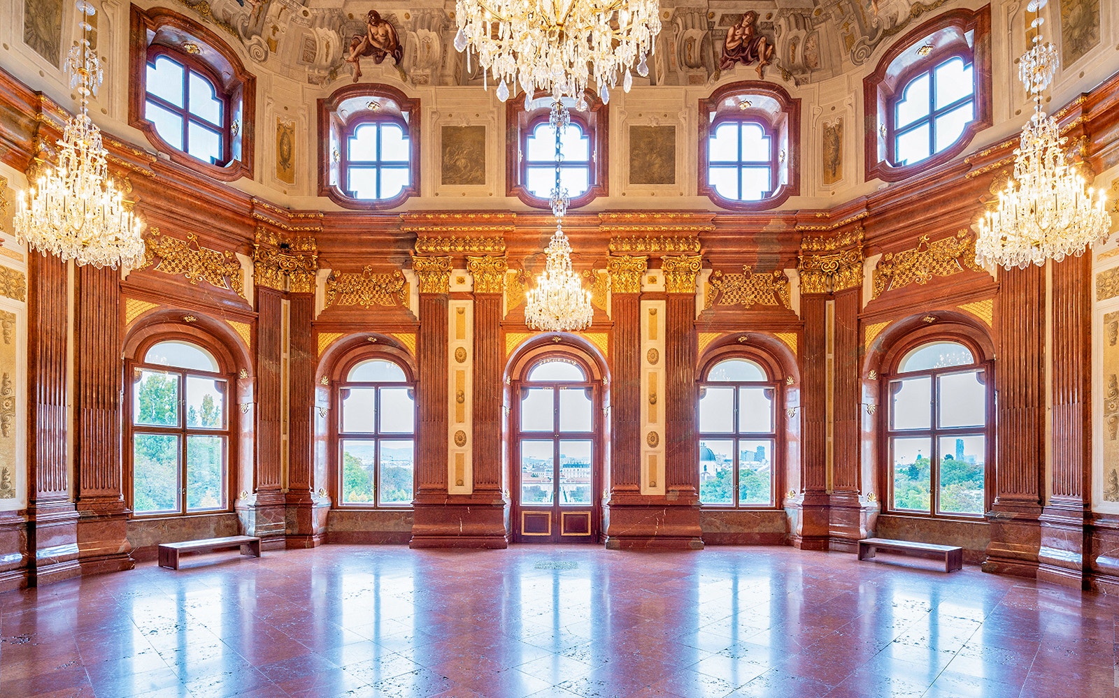 Belvedere Palace interior with ornate chandeliers and large windows, Vienna.