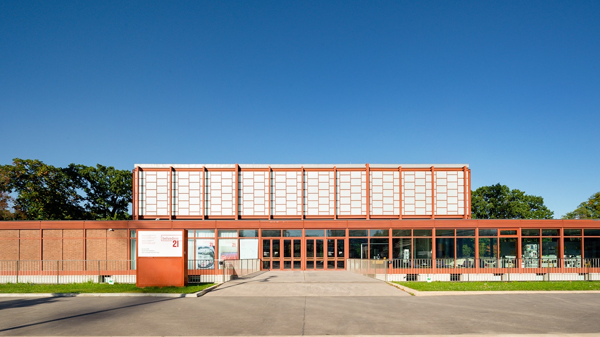 Belvedere 21 Museum entrance in Vienna under clear blue sky.