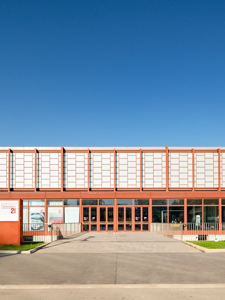 Belvedere 21 Museum entrance in Vienna under clear blue sky.