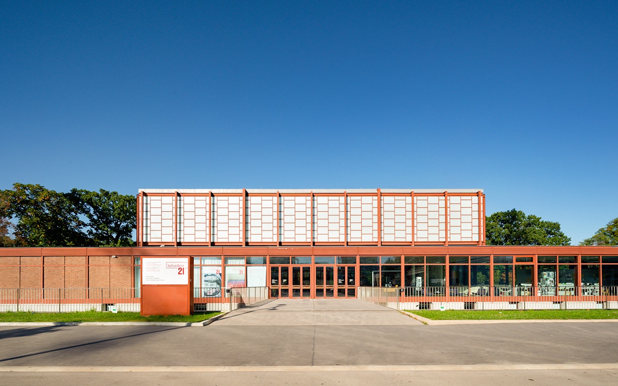 Belvedere 21 Museum entrance in Vienna under clear blue sky.