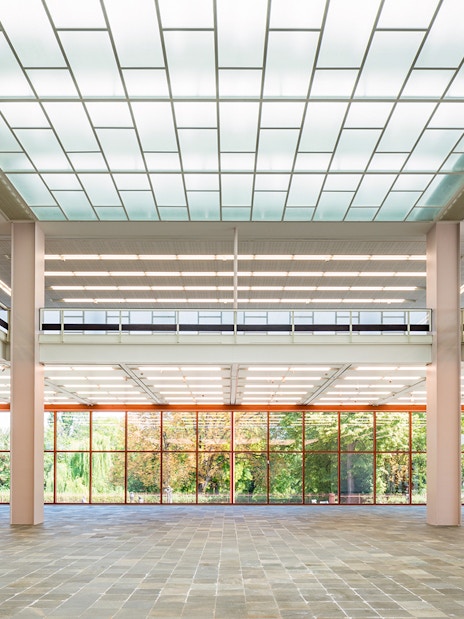 Spacious interior of Belvedere 21 Museum of Contemporary Art with large windows and modern design.