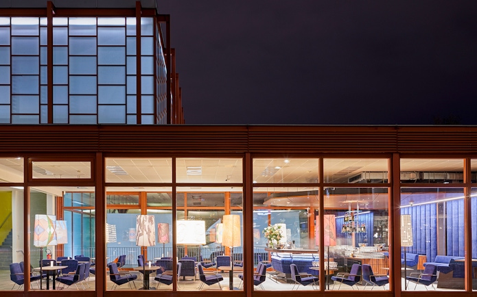 Belvedere Museum of Contemporary Art exterior with illuminated seating area at night.