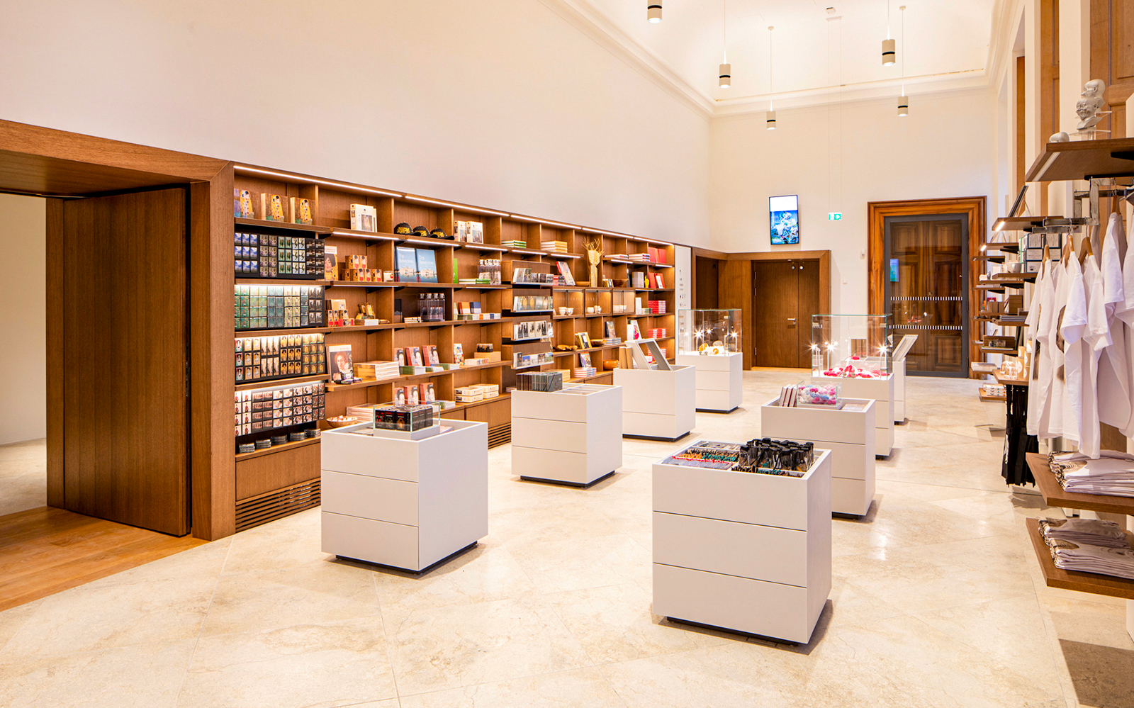 Gift shop inside Belvedere Palace with shelves of souvenirs and display cases.