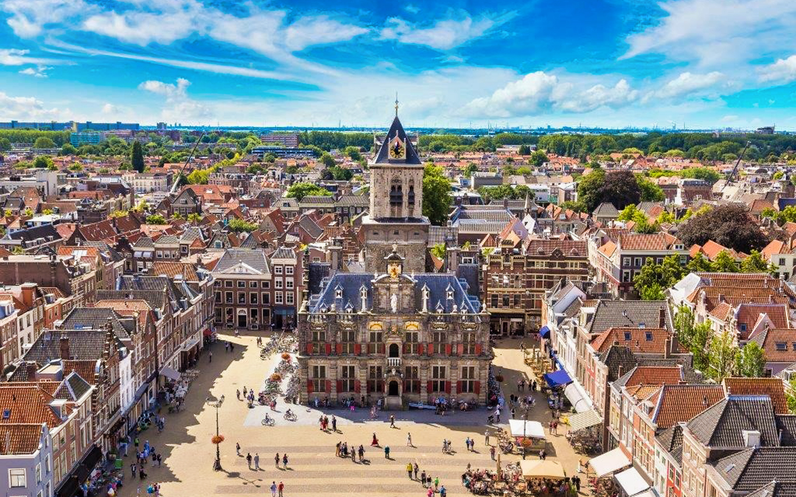 Aerial view of Delft city center with historic buildings, part of Amsterdam day trip.