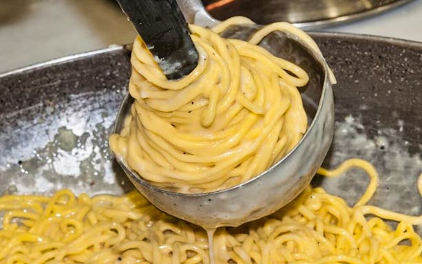 Pasta being prepared in a small group cooking class.