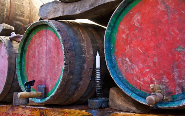 Wine barrels in a Frascati cellar, part of a wine tour from Rome.