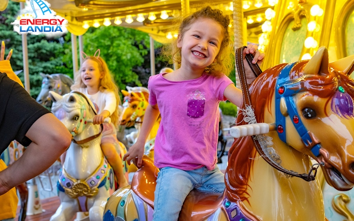 Children enjoying a carousel ride at Energylandia Amusement Park.