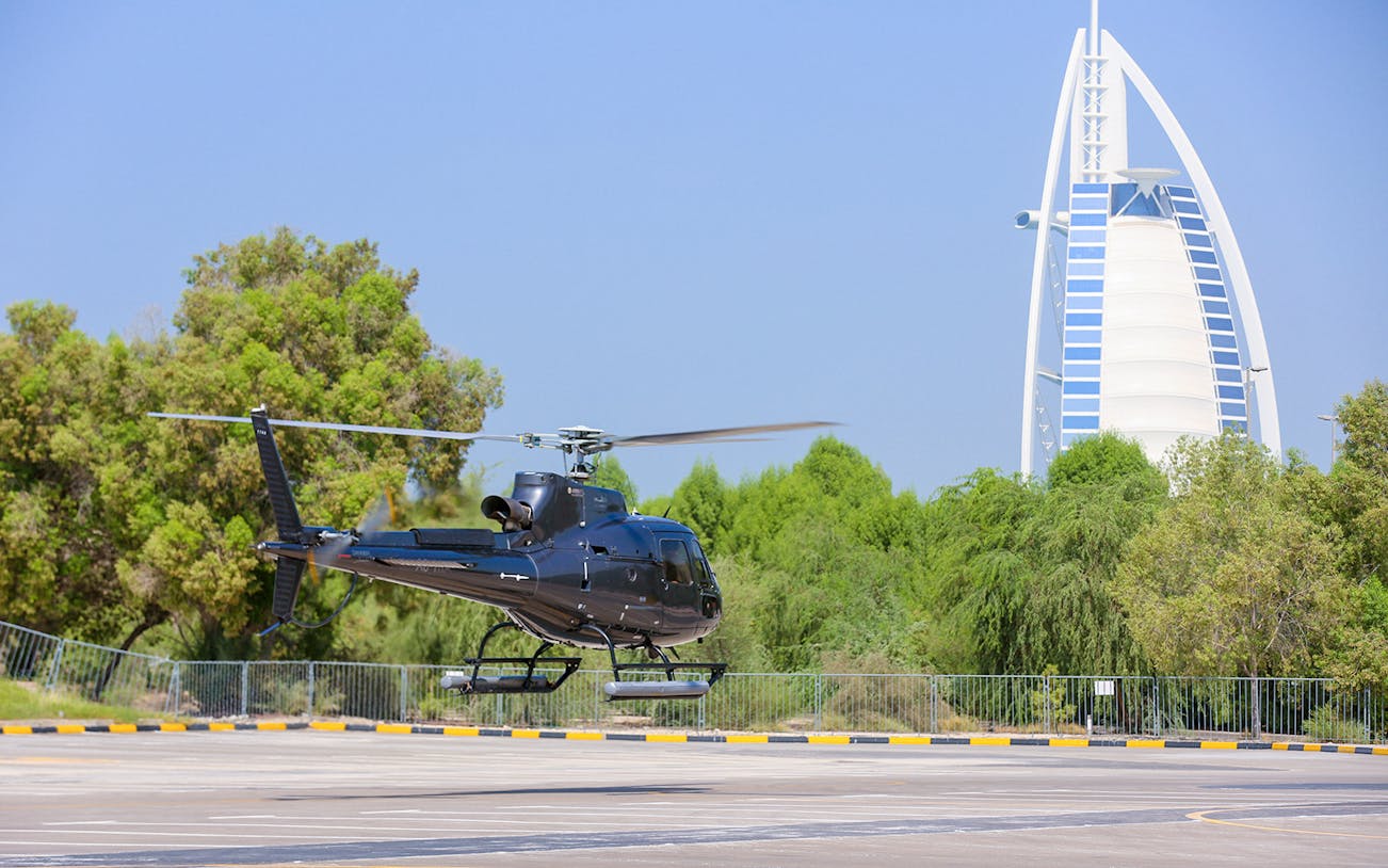 Helicopter taking off near Burj Al Arab, Dubai during a 30-minute grand tour.