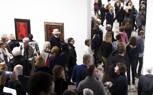 Visitors viewing modern art at Galleria Civica d'Arte Moderna e Contemporanea.