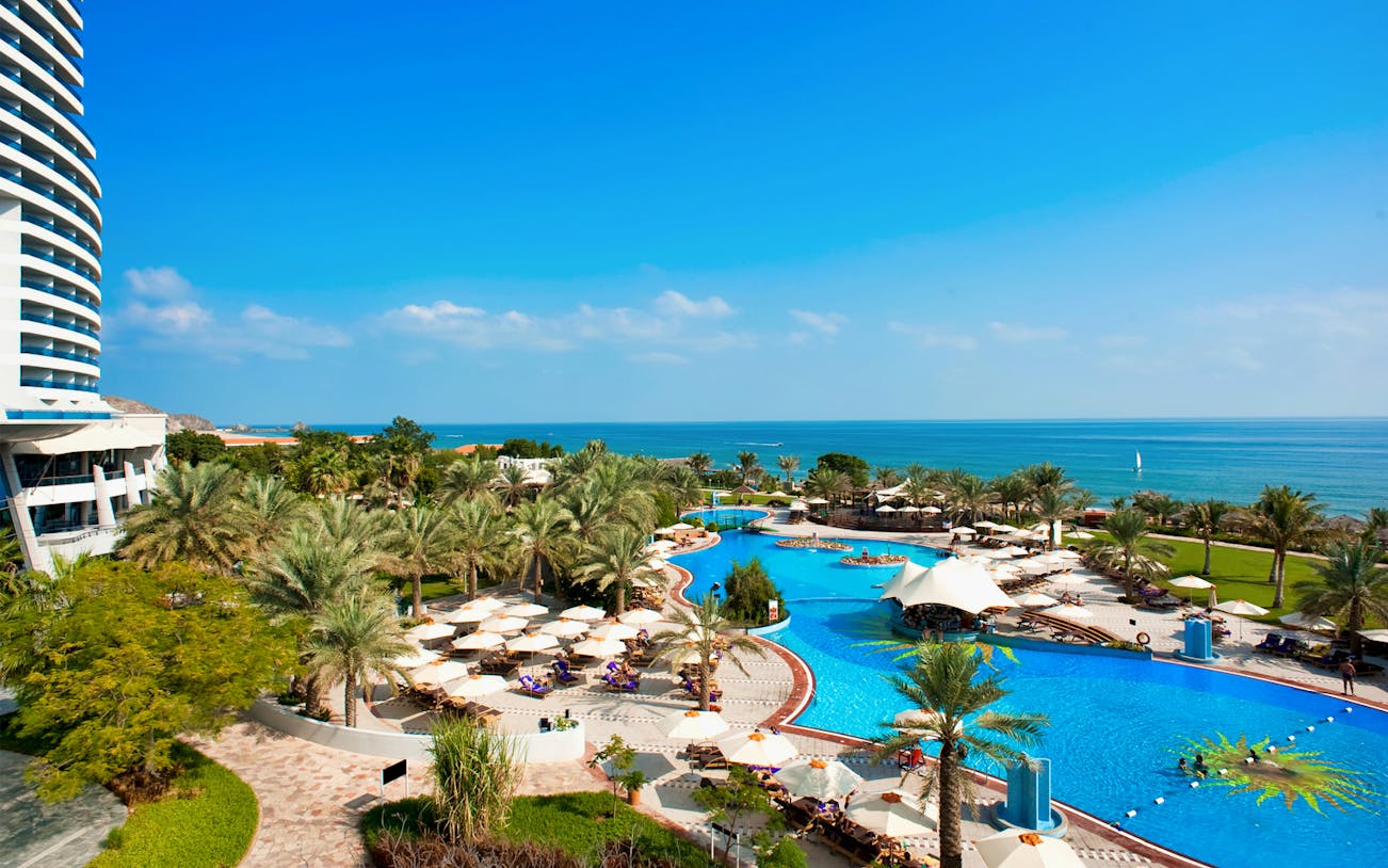Le Meridien Al Aqah beach and pool area with ocean view in Fujairah, UAE.
