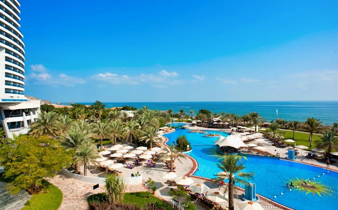 Le Meridien Al Aqah beach and pool area with ocean view in Fujairah, UAE.