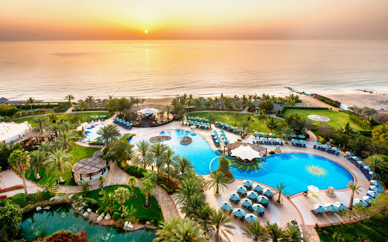 Le Meridien Al Aqah pool and beach view at sunset, Fujairah, UAE.