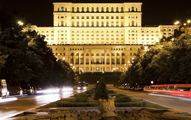 Palace of the Parliament illuminated at night, Bucharest, Romania.