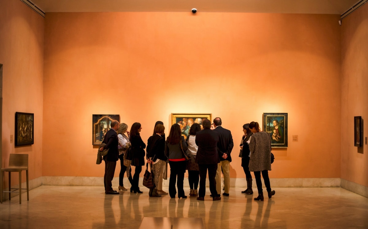 Visitors viewing art at Thyssen-Bornemisza Museum, Madrid.
