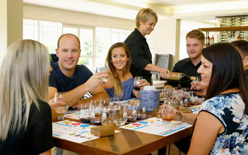 Group enjoying wine tasting on Hunter Valley Food & Wine All Inclusive Small Group Tour.
