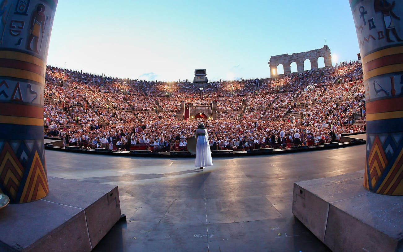 Opera performance at Verona Arena with a full audience, view from the stage.