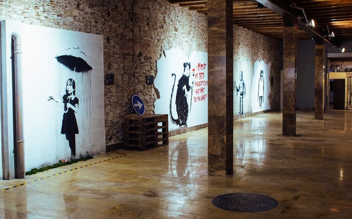 Street art exhibits at Banksy Museum Barcelona.