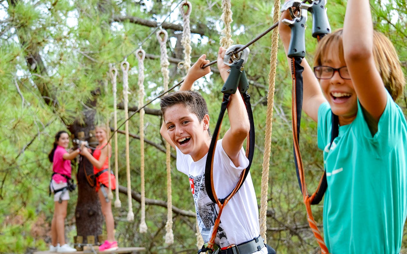 Children enjoying a zipline adventure at Aventura Amazonia.