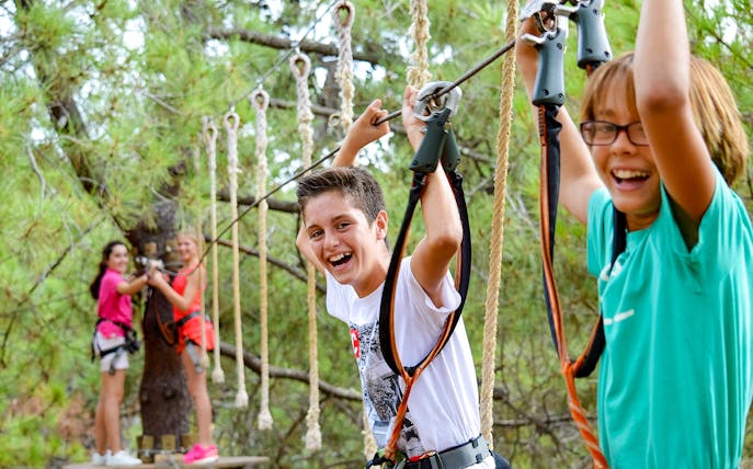 Children enjoying a zipline adventure at Aventura Amazonia.