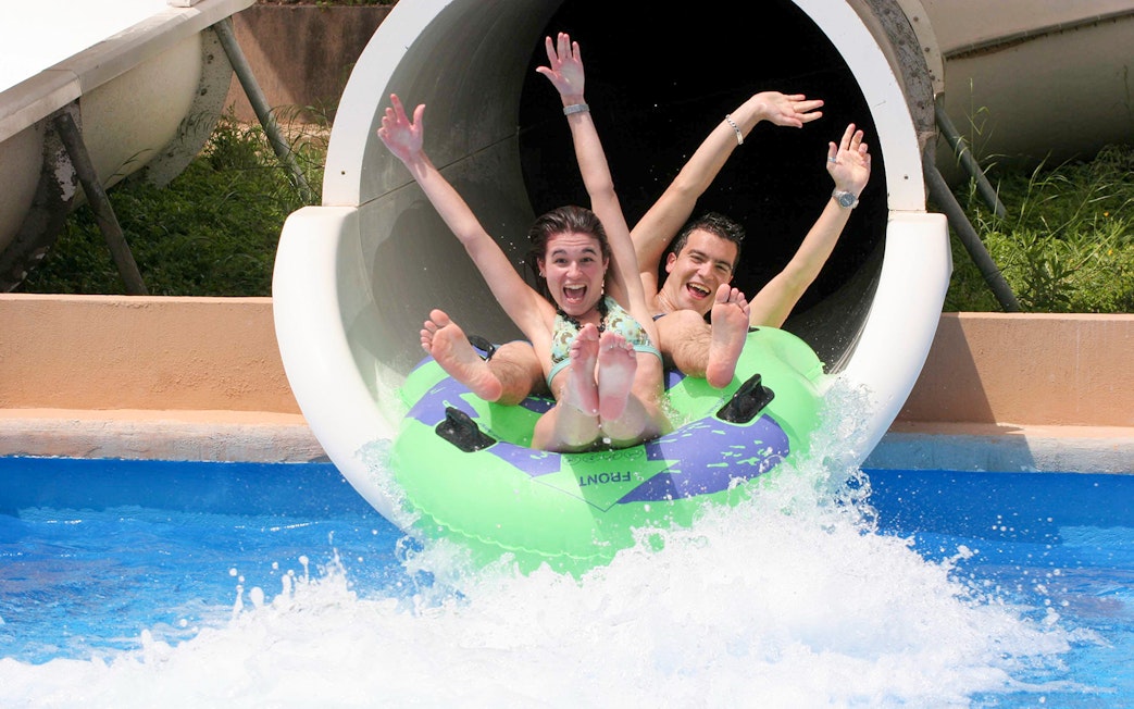 Visitors enjoying a water slide at Terra Natura Benidorm.