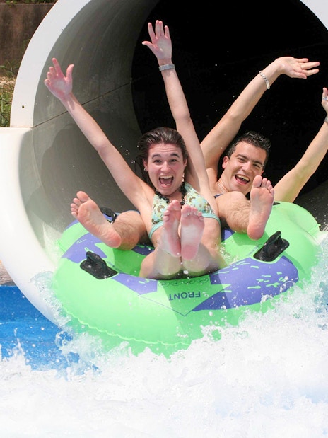 Visitors enjoying a water slide at Terra Natura Benidorm.