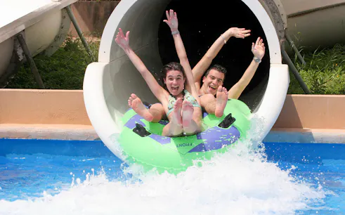 Visitors enjoying a water slide at Terra Natura Benidorm.