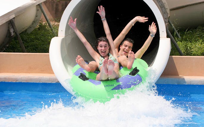 Visitors enjoying a water slide at Terra Natura Benidorm.