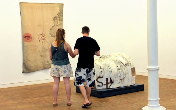Visitors viewing artwork at Antoni Tàpies Foundation in Barcelona.