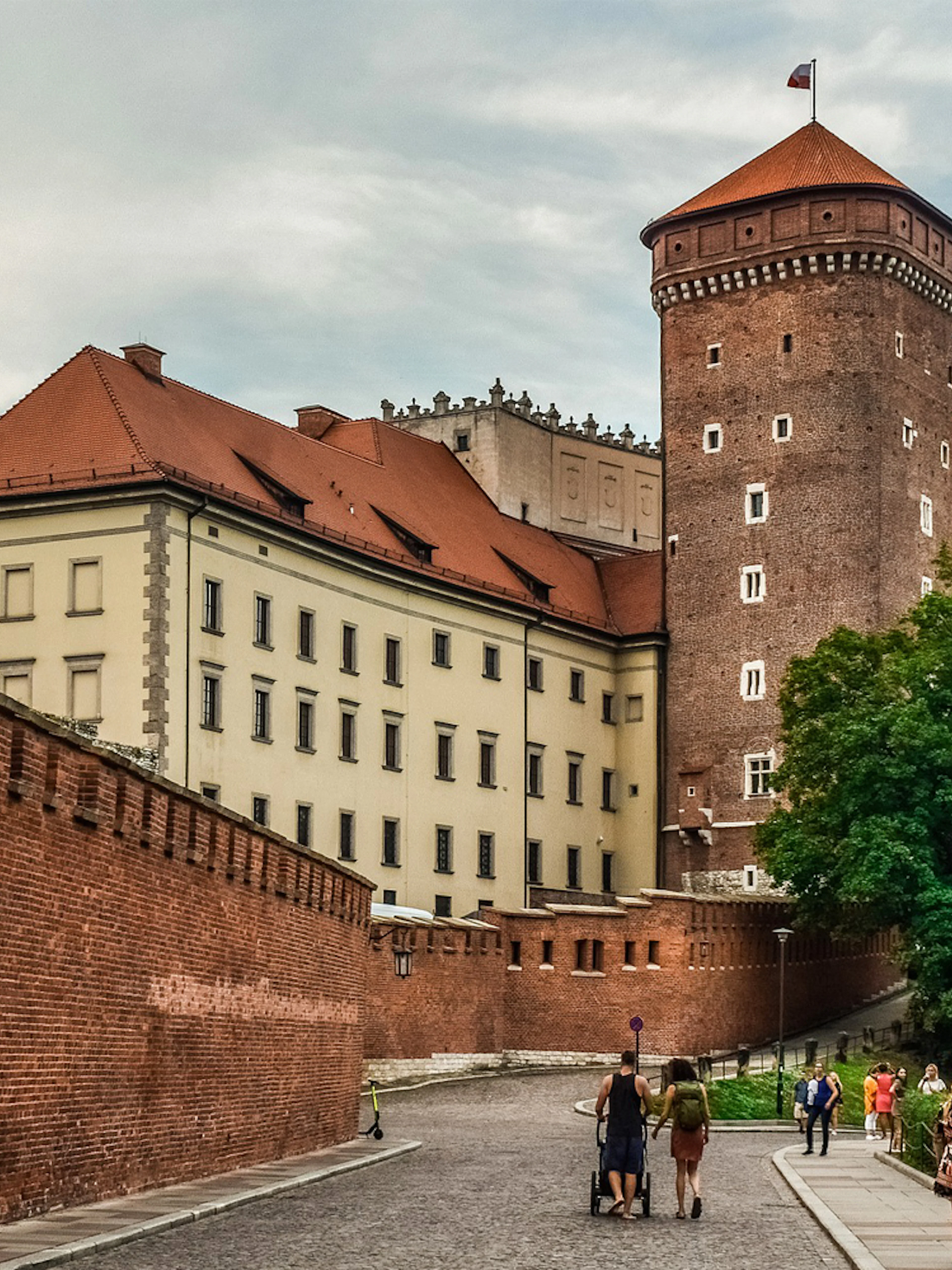 Wawel Castle exterior with tourists on Wawel Hill, Krakow audioguide tour.